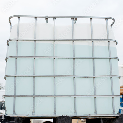 Canvas Print 1000 Litre Intermediate bulk containers Liquid Storage Tank on construction site