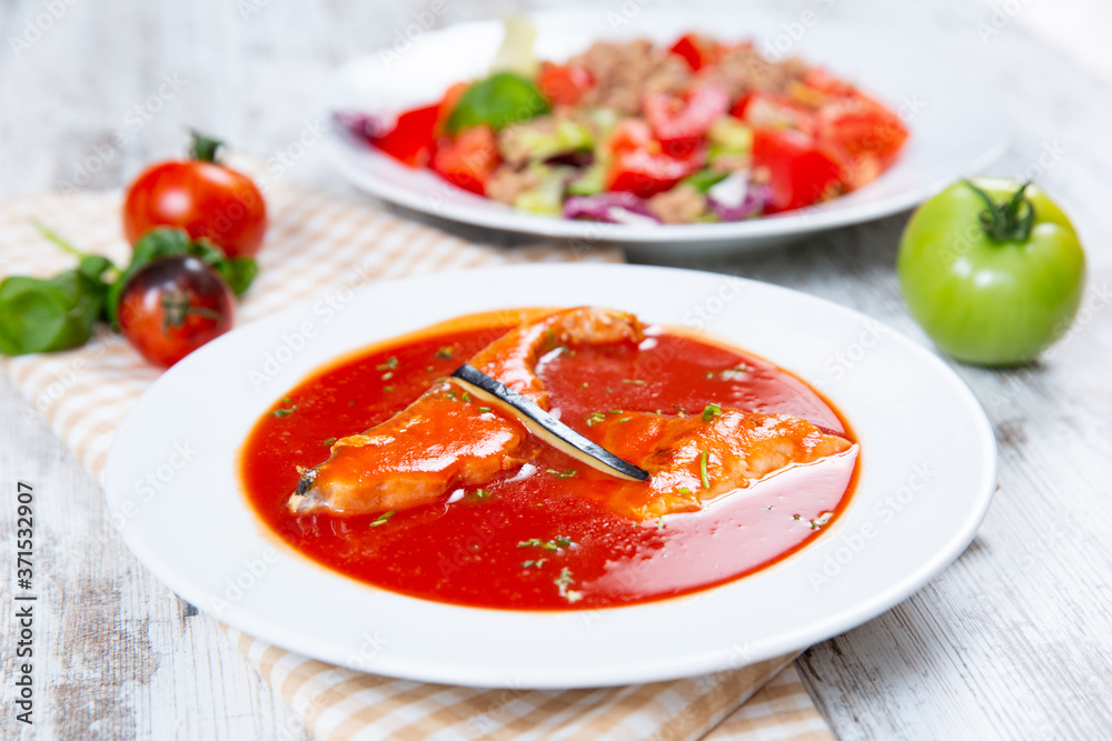 Fish soup in a white plate