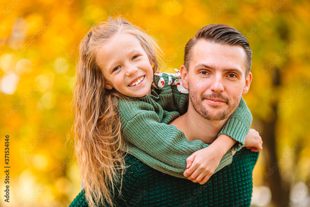 Family of dad and kid on beautiful autumn day in the park Family of dad and kid on beautiful autumn day in the park