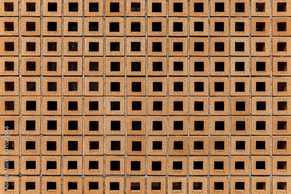 Brown stone block wall seamless background and pattern texture Brown stone block wall seamless background and pattern texture