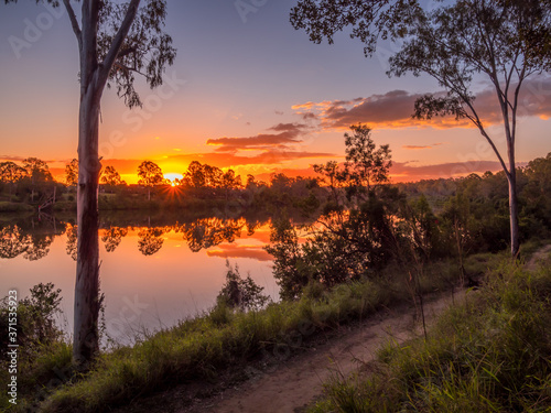 Fototapeta Naklejka Na Ścianę i Meble -  Beautiful Riverside Sunset with Reflections