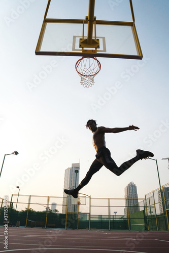 Black man playing basketball game © sashapritchard