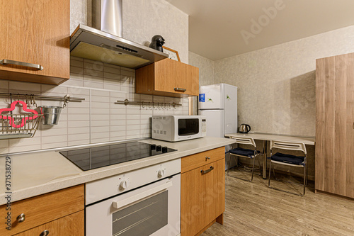 Russia, Moscow- February 10, 2020: interior room apartment modern bright cozy atmosphere. general cleaning, home decoration, preparation of house for sale. modern kitchen, dining area