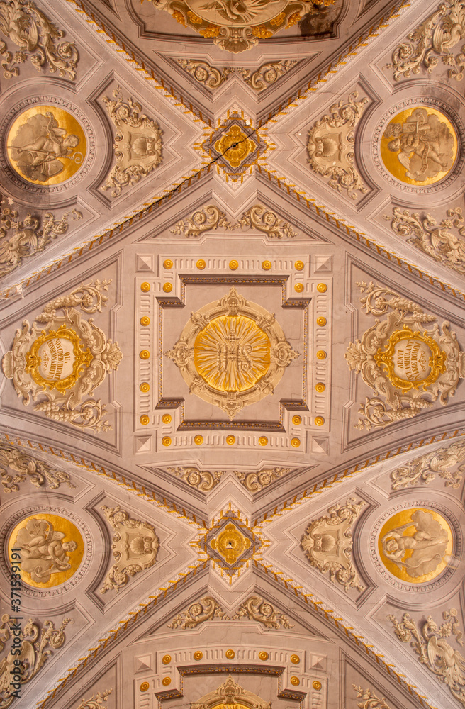 FERRARA, ITALY - JANUARY 30, 2020: The ceiling fresco with JHS initials in church Basilica di San Giorgio fuori le mura by Francesco Ferrari 18. cent.