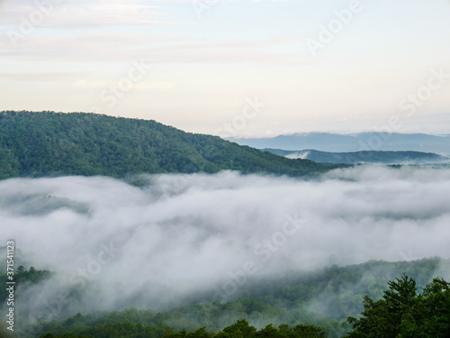 fog in the valley below a scenic overlook along the skyway motorway in the talladega national forest, alabama, usa