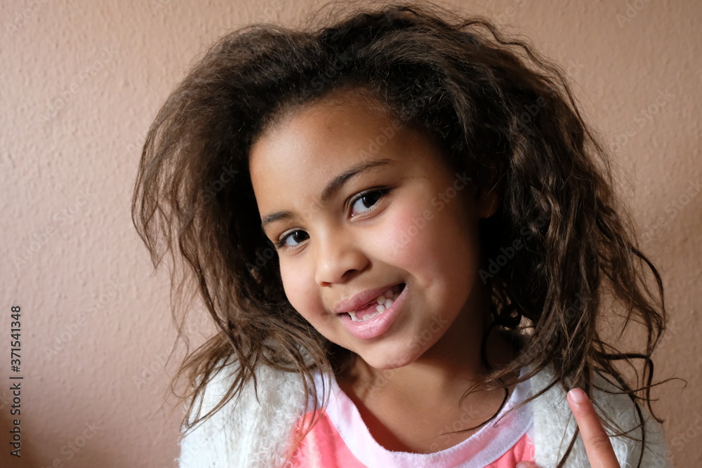 Cute girl daughter with gap teeth smiling and having fun Cute girl daughter with gap teeth smiling and having fun