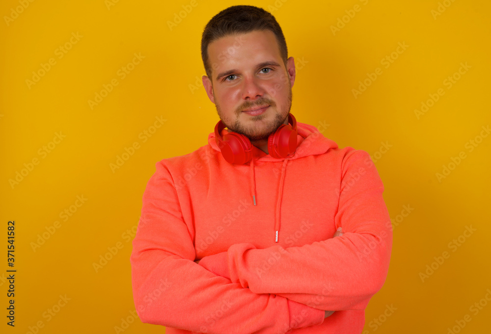 Portrait of young handsome man being happy smiling and crossed arms looking confident at the camera. Positive and confident person. Portrait of young handsome man being happy smiling and crossed arms looking confident at the camera. Positive and confident person.