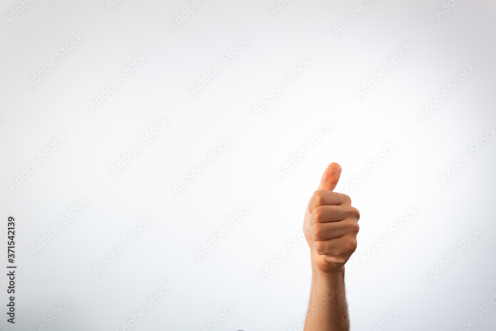 hand giving thumb up on a white background hand giving thumb up on a white background