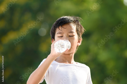 Young boy drink a water