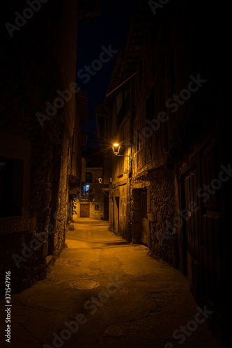 Streets of the village of San Mart  n del Casta  ar illuminated at night  Salamanca  Spain