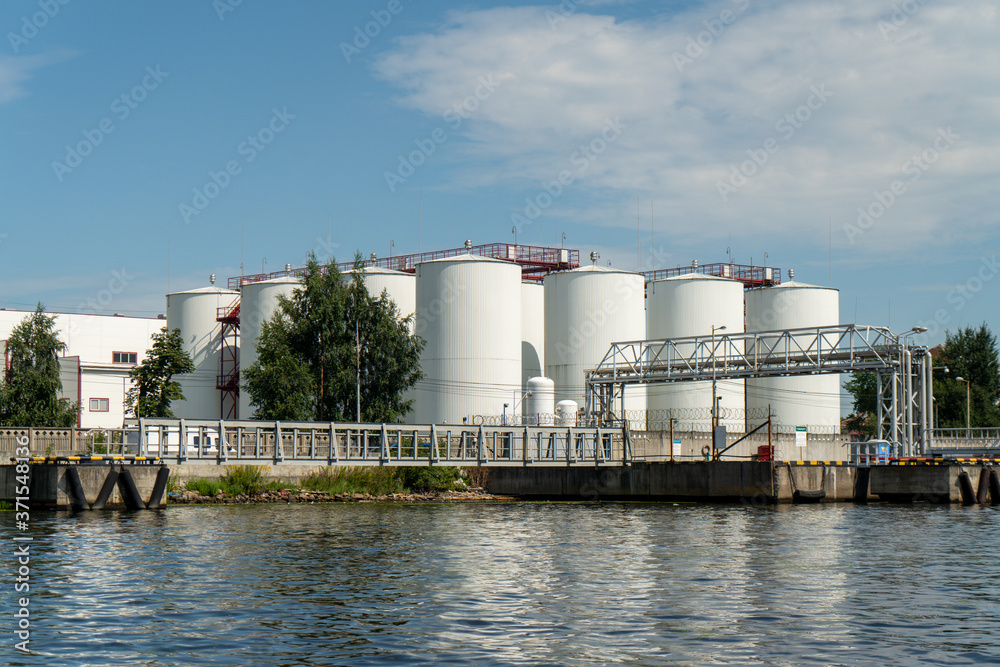 industrial fuel tanks in the seaport, large white Industrial tanks for petrol and oil