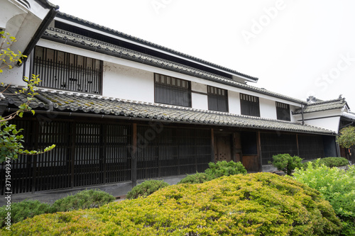 Old house with "udatsu", which is small fence of rich old Japanese house, in Unno Station on Hokkoku Road in Tomi City, Nagano Prefecture