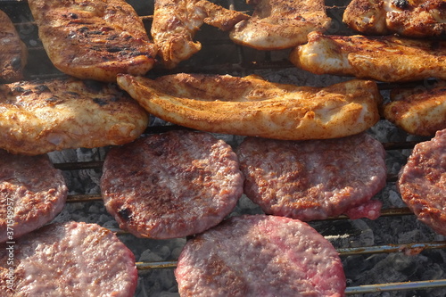 Barbeque Chicken and Beef Burgers on Grill