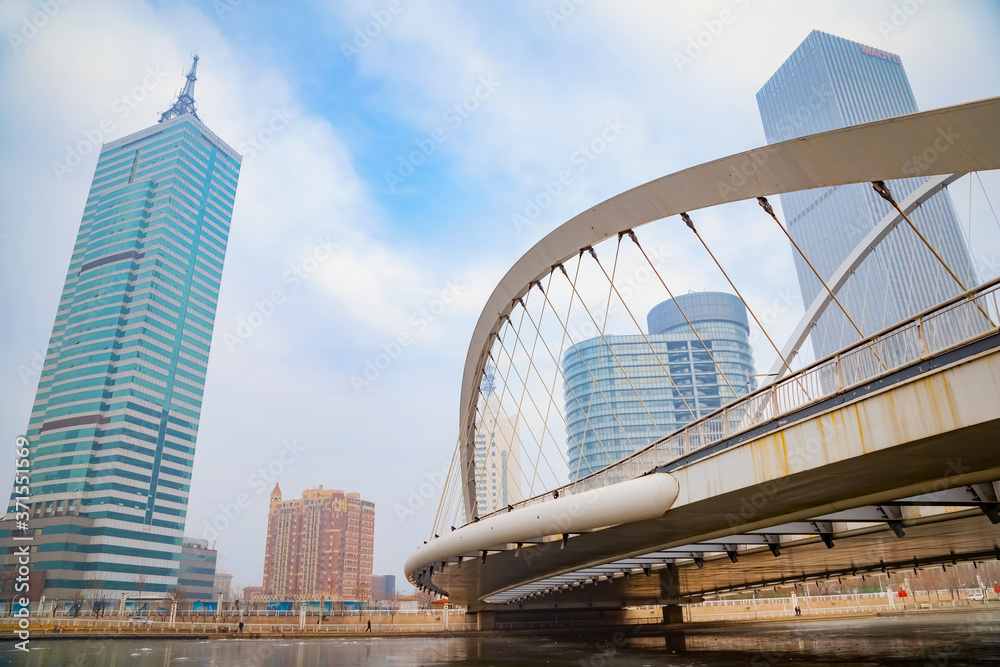 Cityscape of Tianjin city with buiding and architecture on the side of Haihe river bank in China