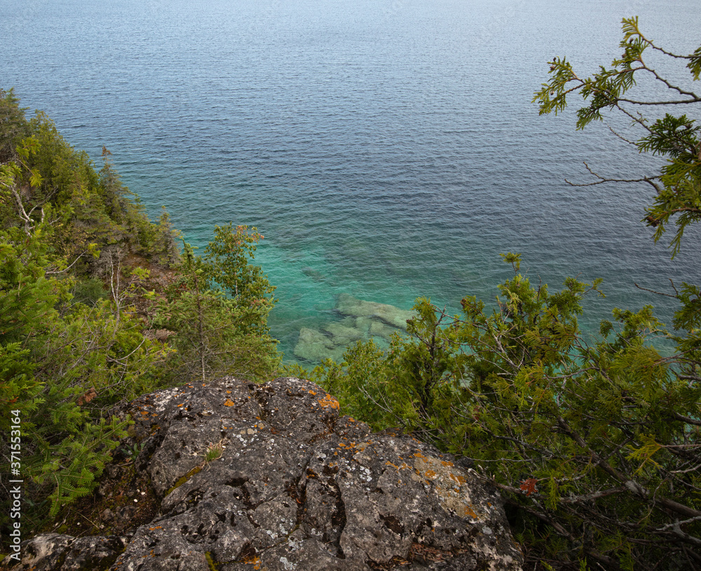 Green waters and limestone rock shoreline of  Georgian Bay along Bruce Peninsula coastal trail