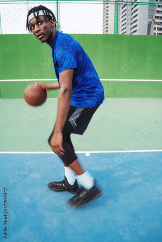 Portrait of the black man with the basketball © sashapritchard