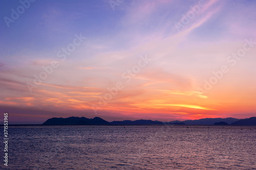Beautiful seascape of sunset background orange color sky.