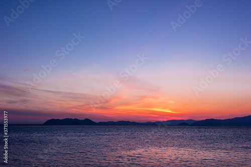 The fantastic sunset island and orange color sky. © Chongbum Thomas Park