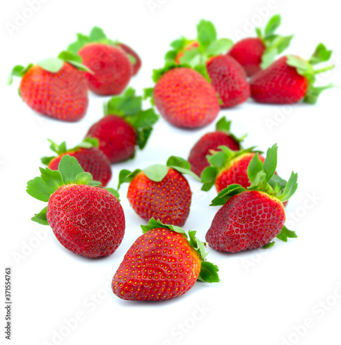 Delicious strawberries over a white background