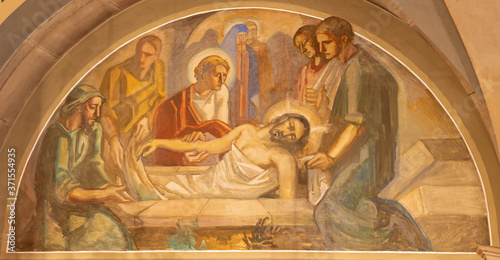 BARCELONA, SPAIN - MARCH 3, 2020: The fresco of Burial of Jesus in the church Santuario Nuestra Senora del Sagrado Corazon by Francesc Labarta (1960). photo