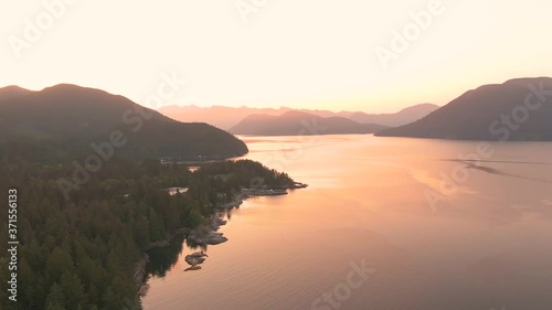 Aerial View of Mermaid Cove during a colorful summer sunrise. Taken in Saltery Bay, Sunshine Coast, British Columbia, Canada. photo