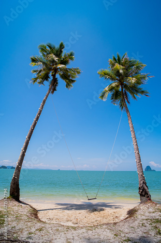 Beautiful beach and swing chair with coconut tree. soft wave and sea view on beach. copy space. view from "Koh Yao Yai" island in Phang nga is near Phuket Thailand © Anucha