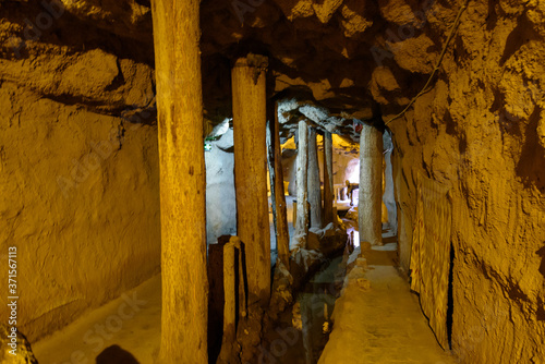 Over 2000 years old Karez Well system, ancient underground irrigation system in Turpan, Xinjiang, China. Image noisy due to high ISO. photo