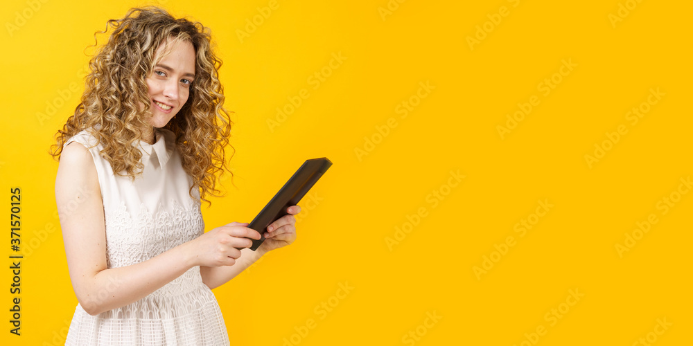 Portrait of a young woman who communicates on a tablet. Female portrait. Portrait of a young woman who communicates on a tablet. Female portrait.