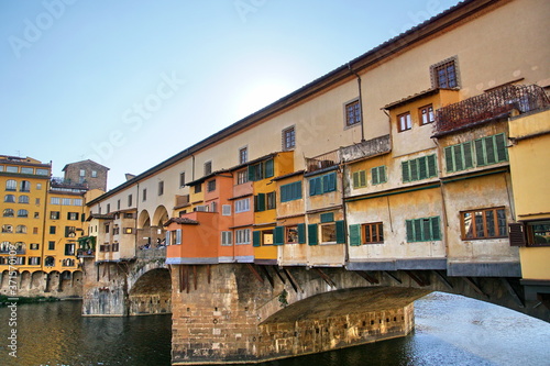 Iconic Vecchio Bridge in Florence over river Arno called Ponte Vecchio - Tuscany, Italy