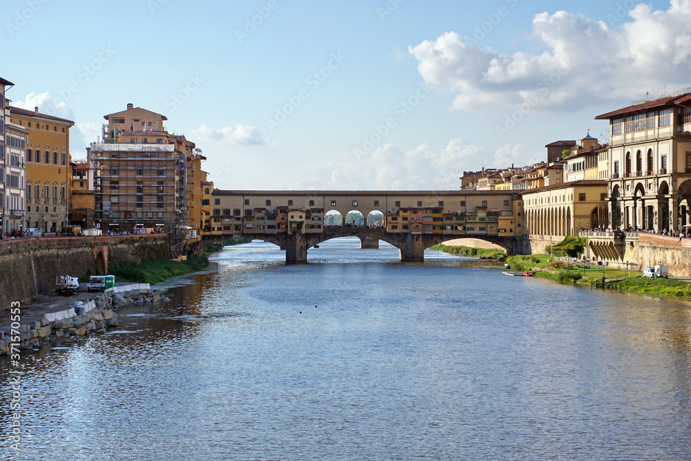 Iconic Vecchio Bridge in Florence over river Arno called Ponte Vecchio - Tuscany, Italy