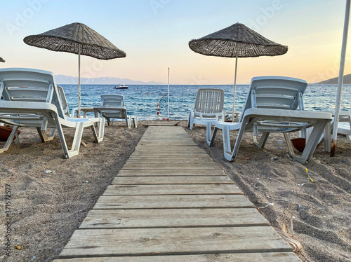 empty beach and sunbeds in the evening