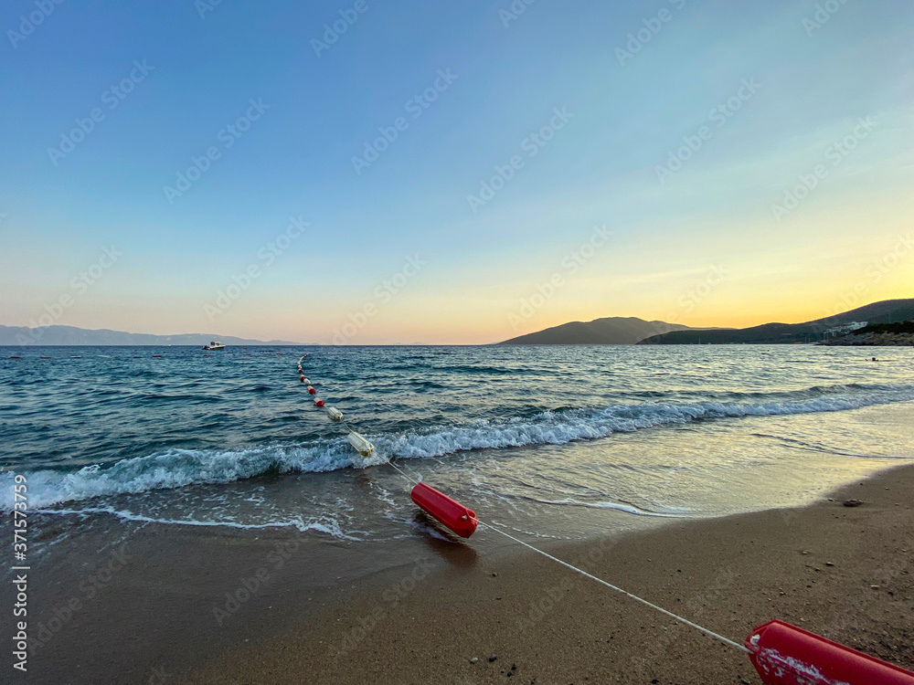 evening sun beach, wavy blue sea on empty beach evening sun beach, wavy blue sea on empty beach