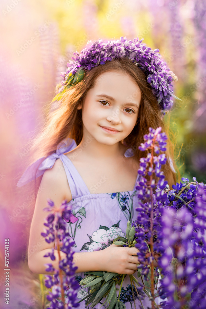portrait of a girl with a bouquet of wild flowers.Child in nature portrait of a girl with a bouquet of wild flowers.Child in nature