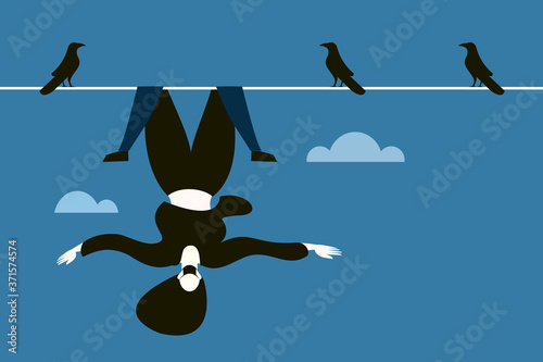 Conceptual image of a woman wearing mask hanging upside down on a wire high in the air.