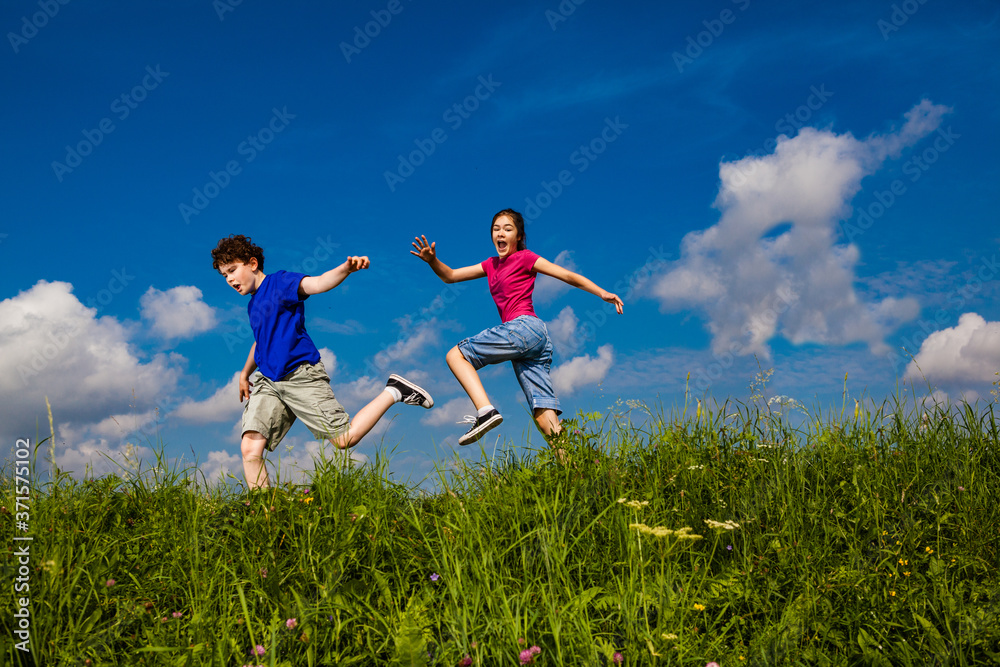 Girl and boy running, jumping outdoor
Girl and boy running, jumping outdoor