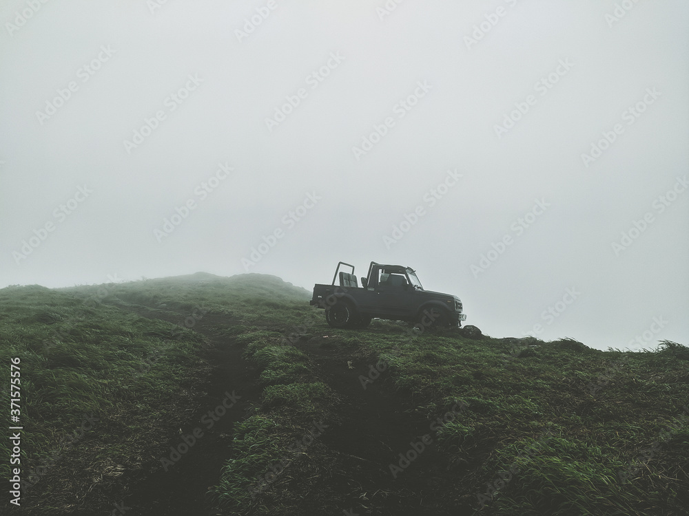 Naklejka premium tractor on a hill