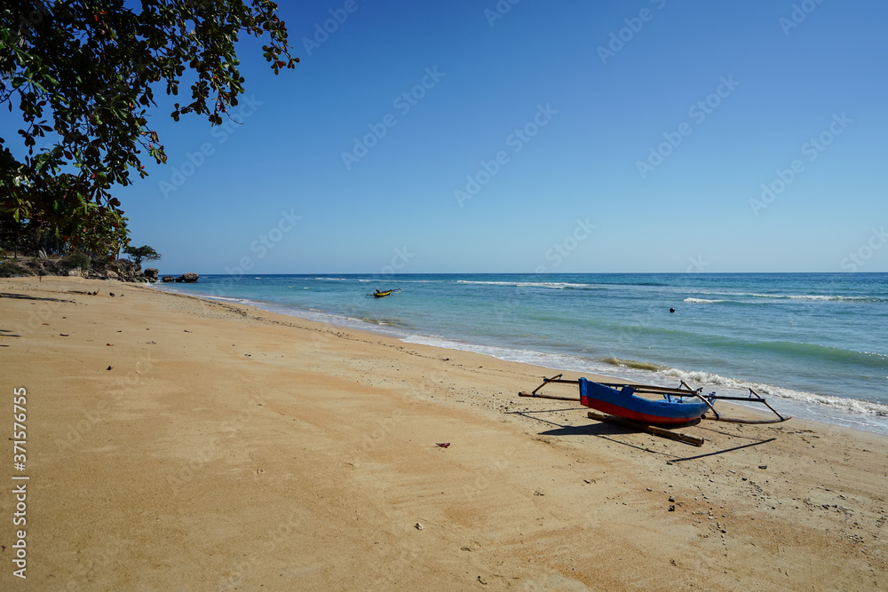 Timor Leste beach near Baucau with traditional wooden catamaran style boats