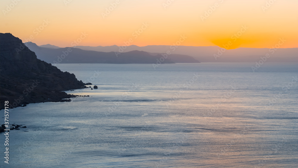 sea bay with rocky coast at the sunset, outdoor natural background