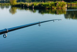 Fishing rod on the background of water.