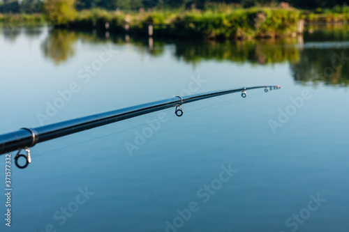 Fishing rod on the background of water.