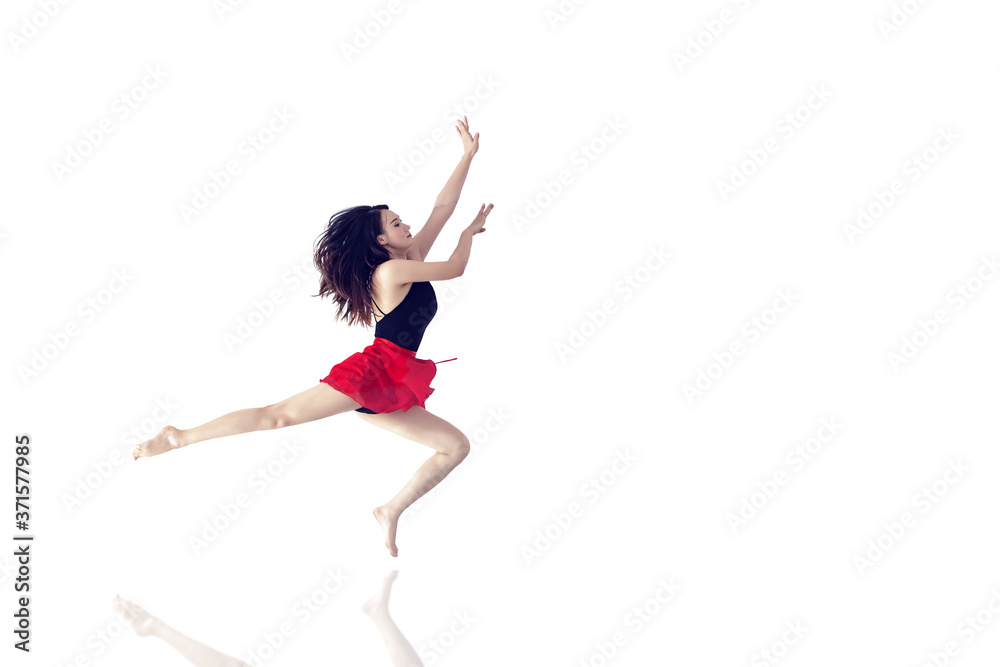 A long-legged girl jumping in front of a minimalist, graceful background A long-legged girl jumping in front of a minimalist, graceful background