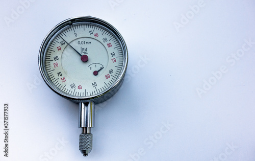 Metal pressure gauge on white isolate