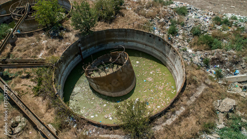 Aerial view of a tank polluted with waste at abandoned Sewage treatment plant in Chimishlia  Moldova