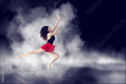 A long-legged girl jumping in front of a minimalist, graceful background