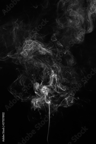 Abstract smoke moves on a black background. Design element. Abstract texture.