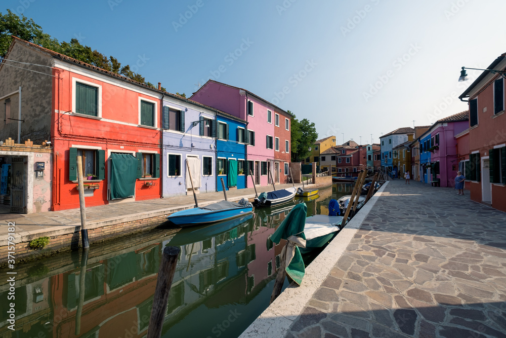 Burano Venice. Situated on the Venetian lagoon 7 km from Venice, the island is famous for its colorful houses and numerous canals