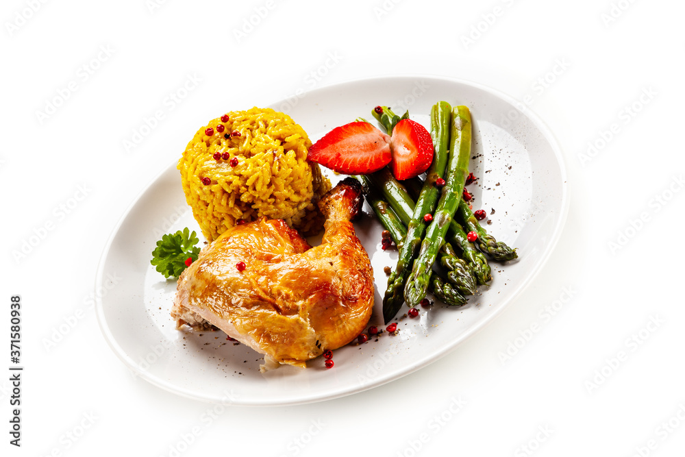 Deep fried chicken drumsticks with rice and asparagus on white background
Deep fried chicken drumsticks with rice and asparagus on white background