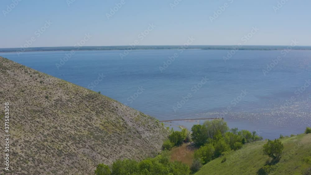 Steep bank of the river from a bird's eye view. Bank of the Volga River in Russia. Aero 4k Steep bank of the river from a bird's eye view. Bank of the Volga River in Russia. Aero 4k