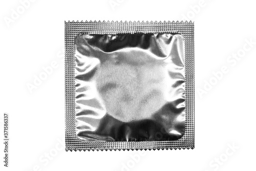 Condom template with silver foil on white background photo