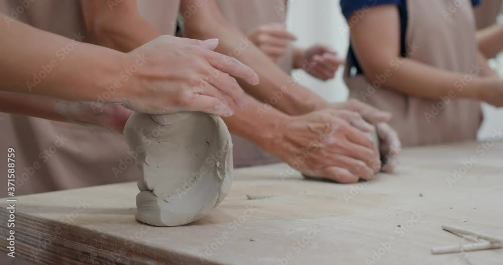 Kneading clay material before making pottery Kneading clay material before making pottery
